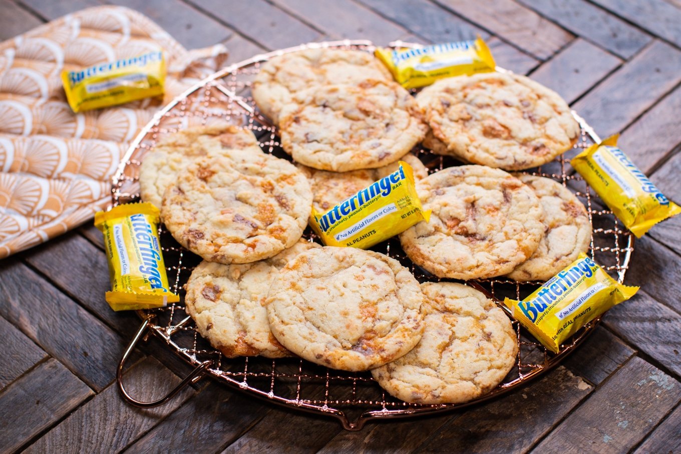 mini butterfinger candy bars and butterfinger cookies on a cooling rack