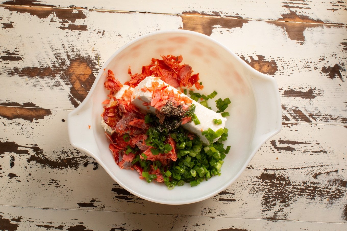 bowl with cream cheese, green onion and smoked salmon