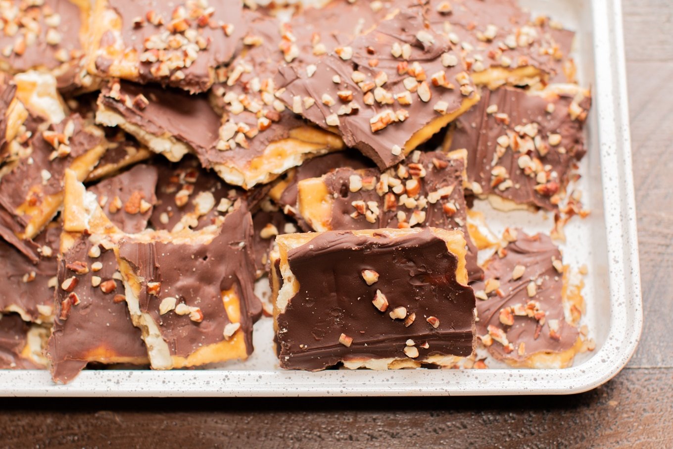 close up of saltine cracker toffee on sheet pan