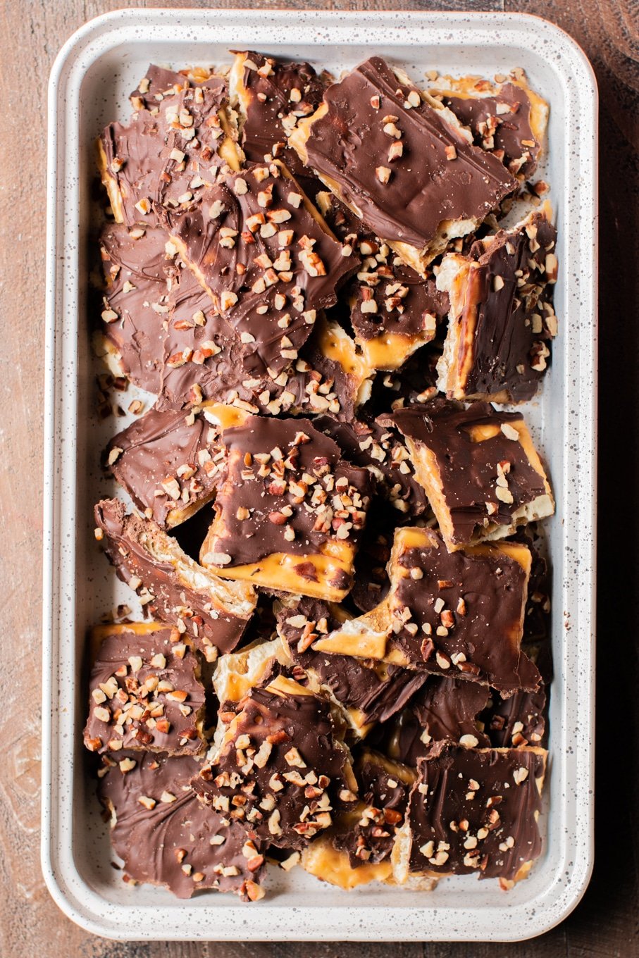 pieces of soda cracker toffee on sheet pan