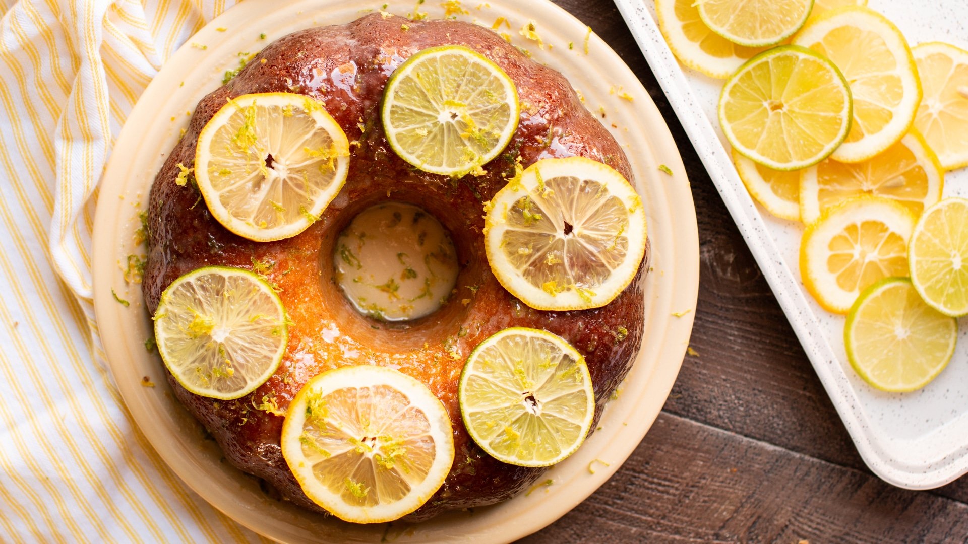 budnt cake with lemons and limes on top