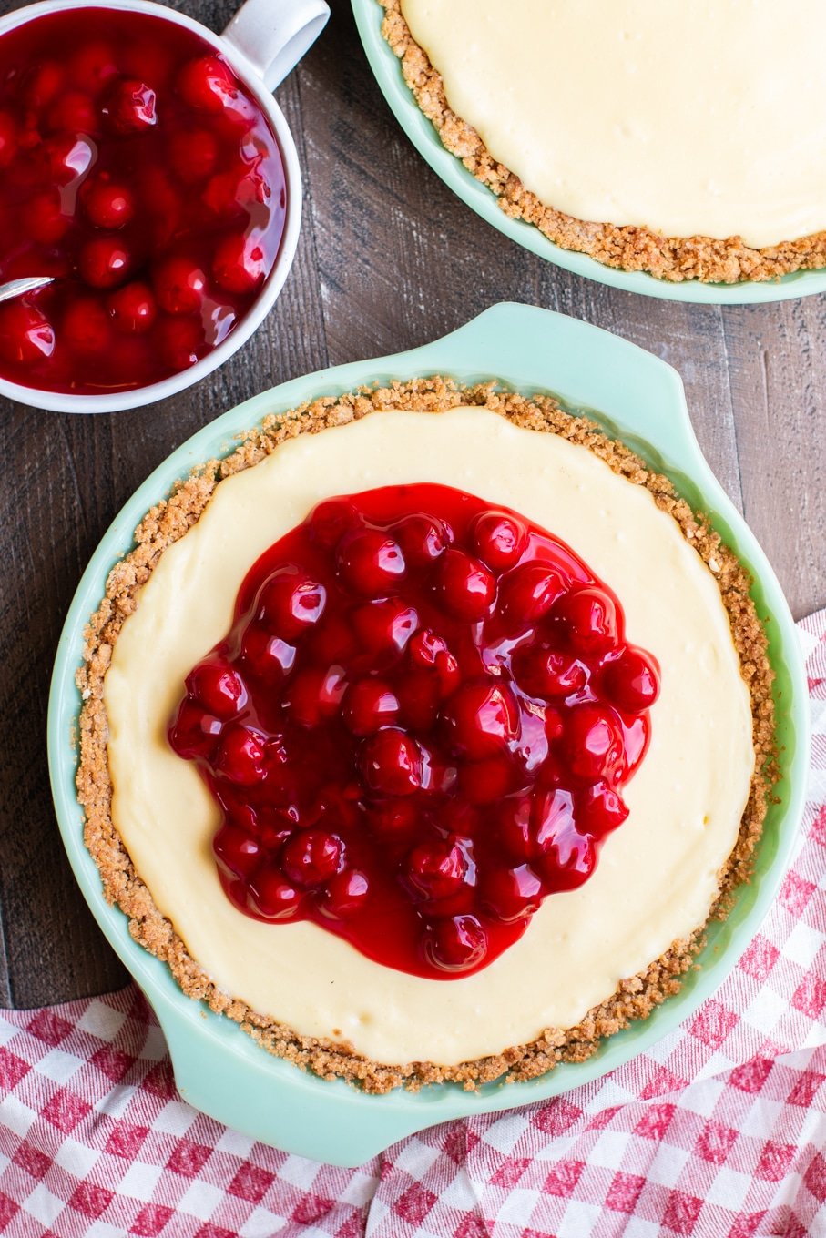 cream cheese pie with cherries on top.