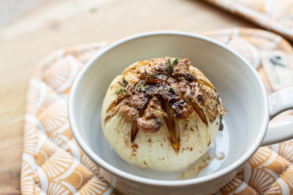 one baked onion in a bowl