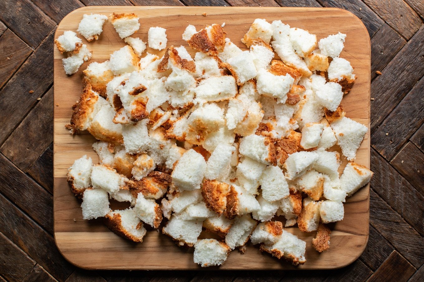 cut up angel food cake on cutting board