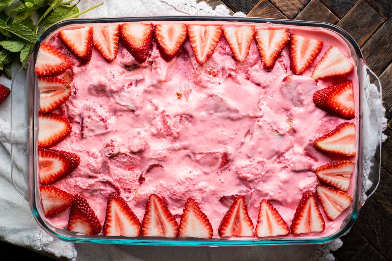 9x13 pan with strawberry jello dessert in it.