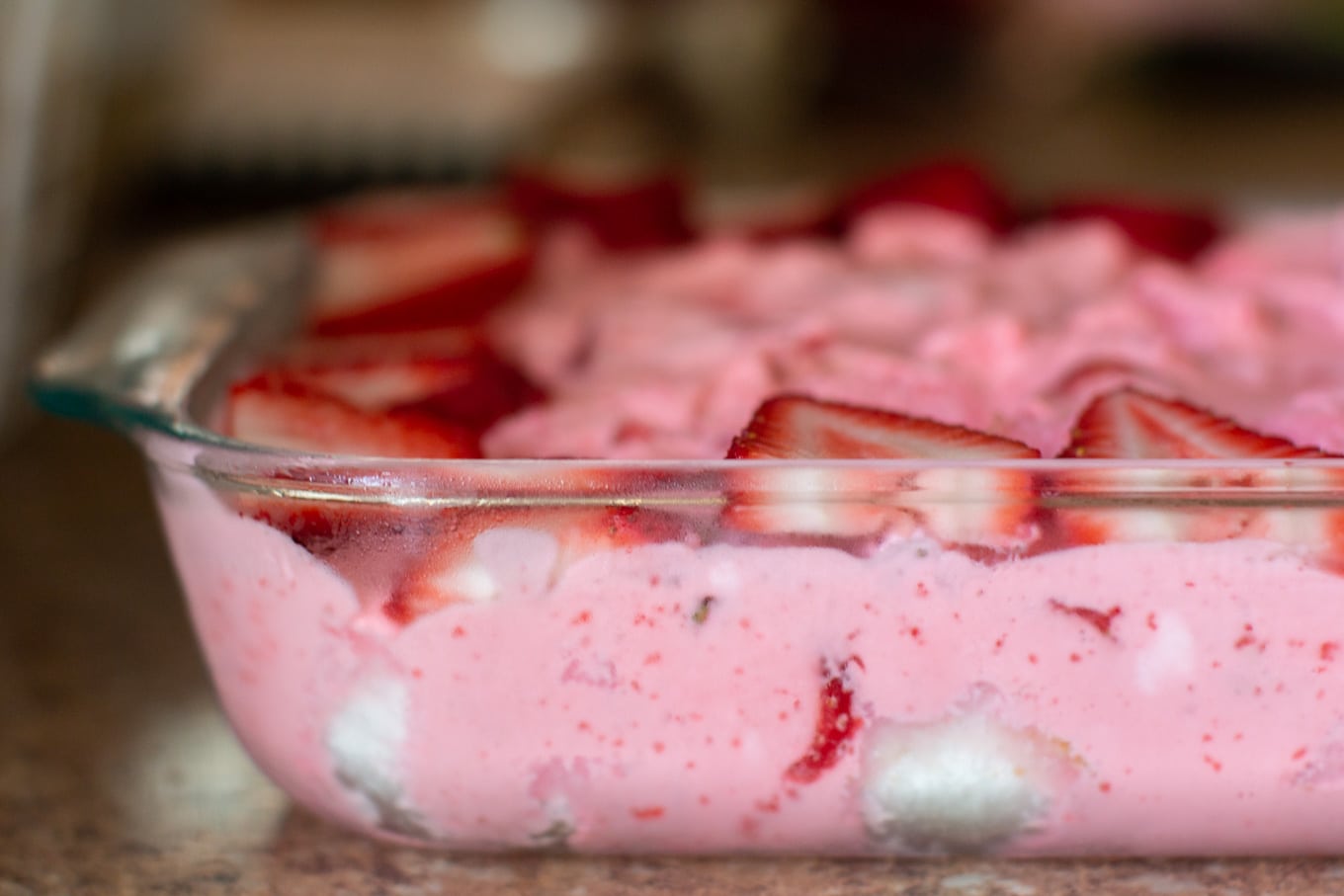 side view of angel food dessert in glass pan