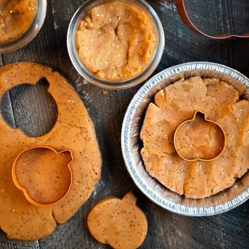 pumpkin dough with cookie cutters and mini pie tin.