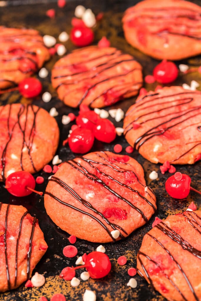 cookies and cherries on a sheet pan