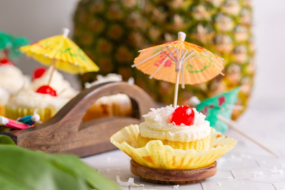 pina colada cupcake with wrapper halfway off