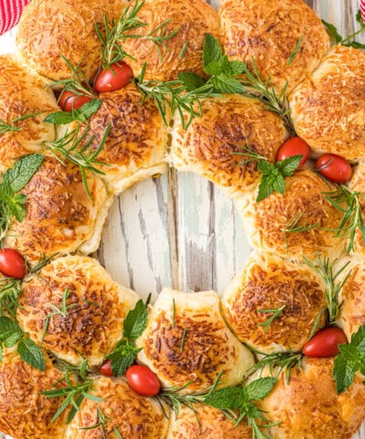 close up of cheese bread wreath with bow