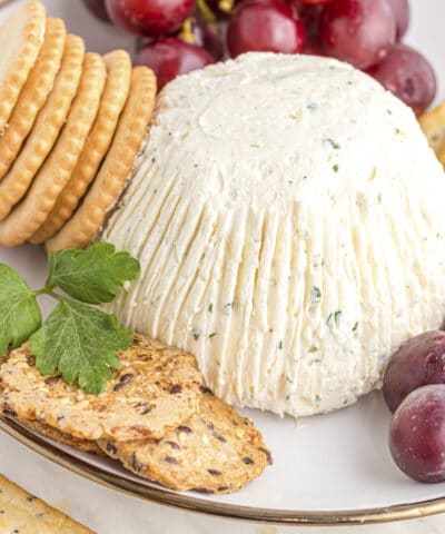homemade boursin cheese with crackers and grapes