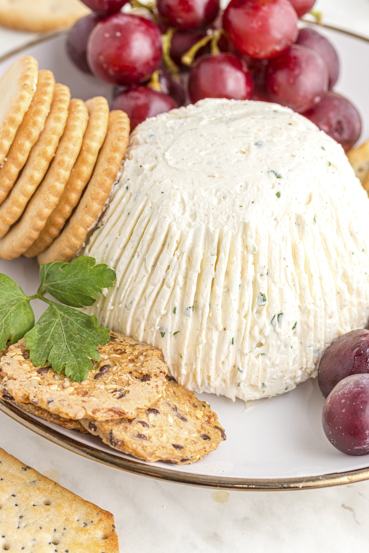 homemade boursin cheese with crackers and grapes.