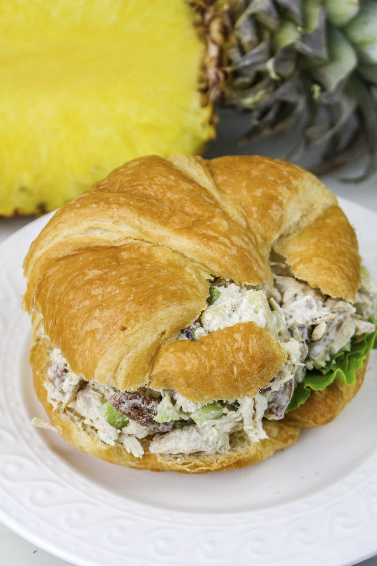 pineapple chicken salad on a croissant.