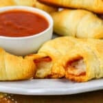 close up of pizza rolls on a plate.