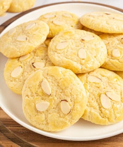 Plate full of almond cookies.