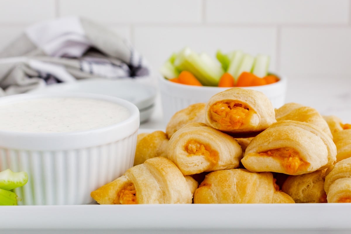 tray of rolled crescent rolls with buffalo chicken.