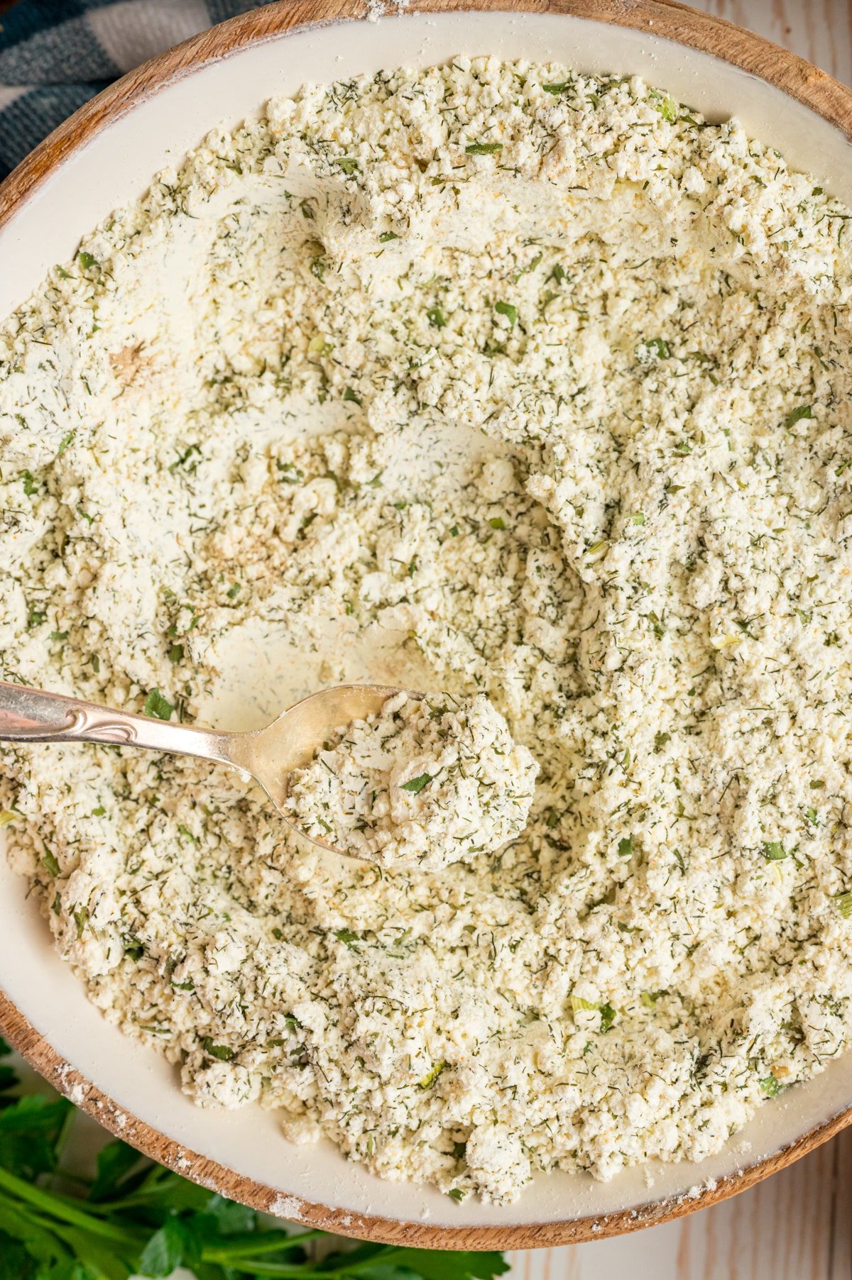 Homemade ranch mix in a bowl with a metal spoon.